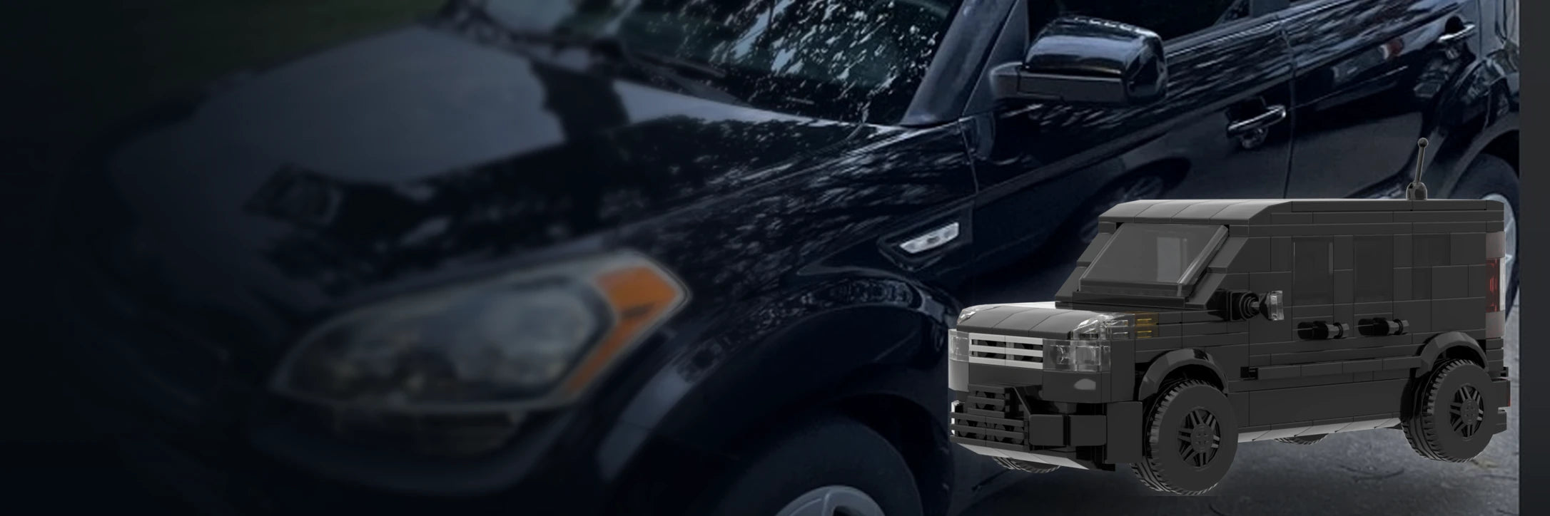 Real black Kia Soul beside its matching custom brick model