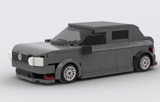 Gray brick sedan design with light-colored wheels and simplified front lights