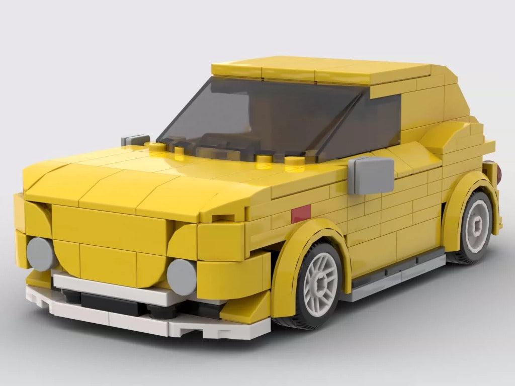 Yellow brick car design showing a smooth roof and curved wheel-arch elements