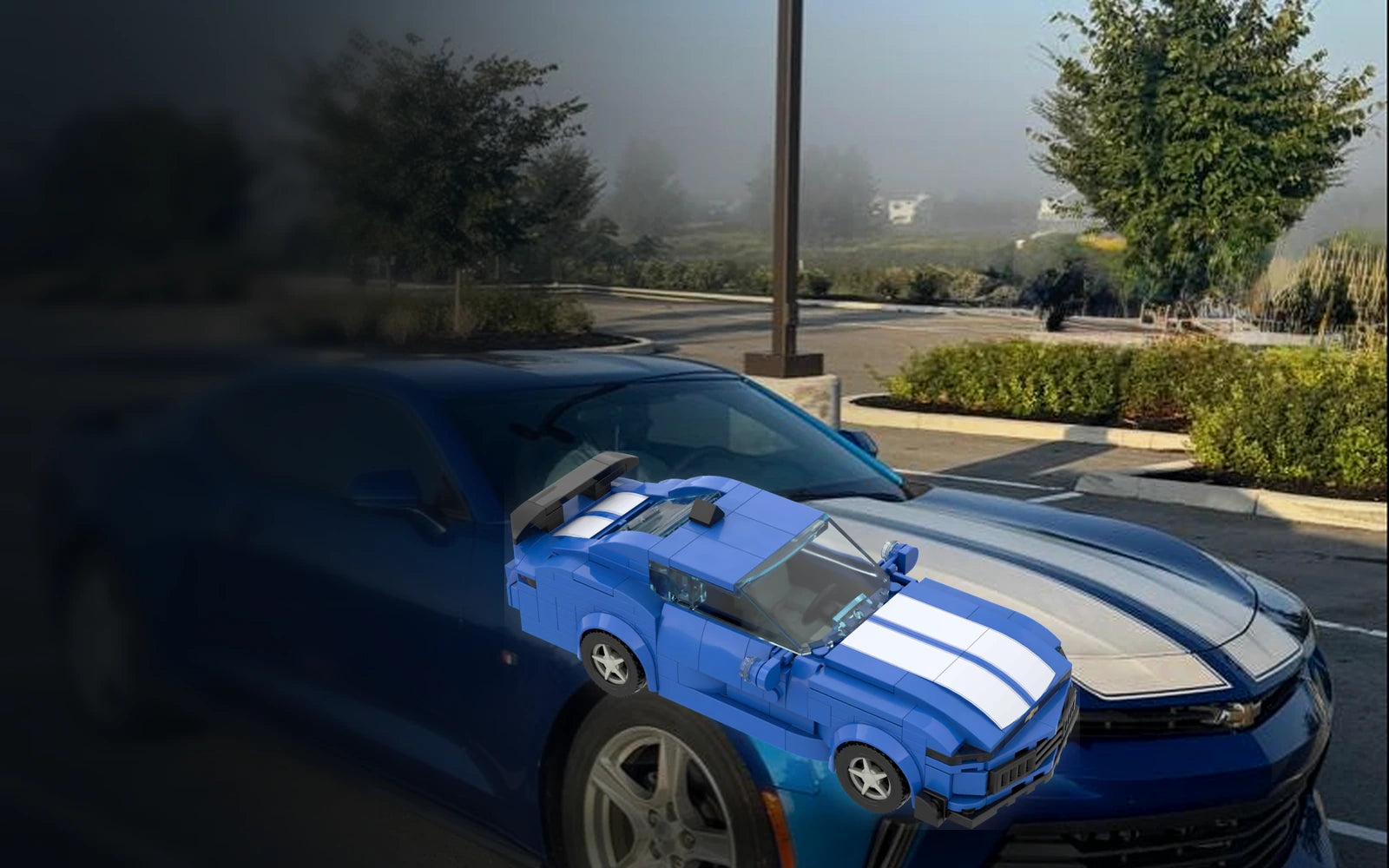 Real blue performance coupe beside its matching custom brick model