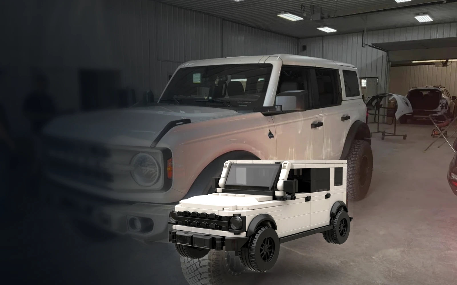 Real white off-road SUV beside its matching custom brick model